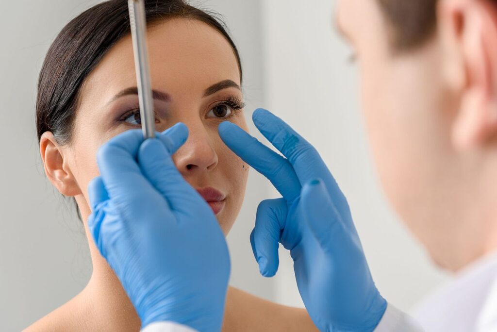 Doctor examining a woman for allergies and chronic sinusitis treatment