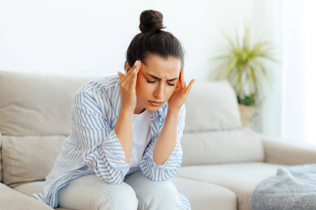 Woman experiencing headache and sleep apnea symptoms in St. Louis, MO