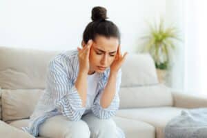 Woman experiencing headache and sleep apnea symptoms in St. Louis, MO