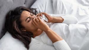 Woman with seasonal allergies in St. Louis, MO